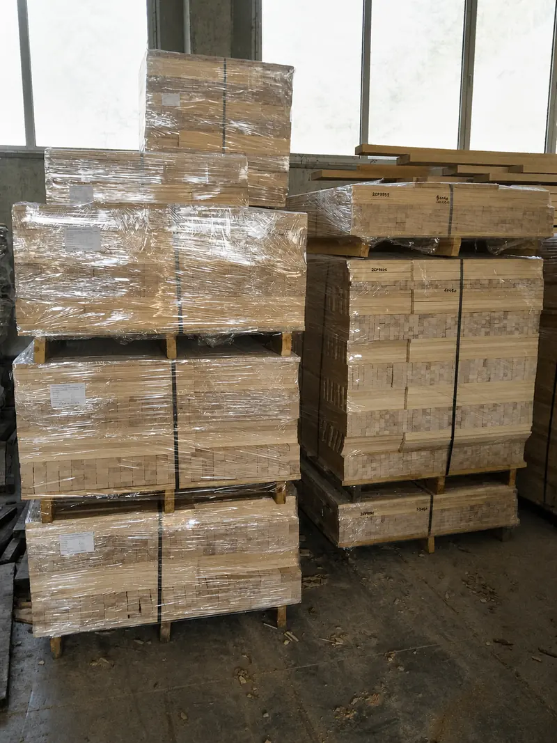 Labelled and wrapped pallets of beech slat packs staged for dispatch