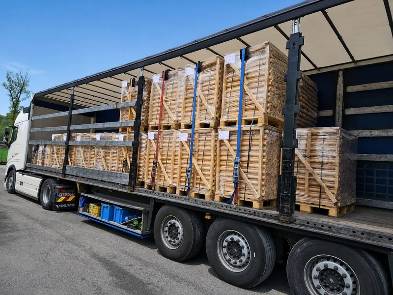 Crated pallets of round machined beech blanks for bottle stoppers on a trailer