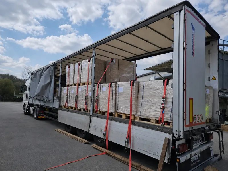 Truck and trailer fully loaded with palletised element packs at the plant