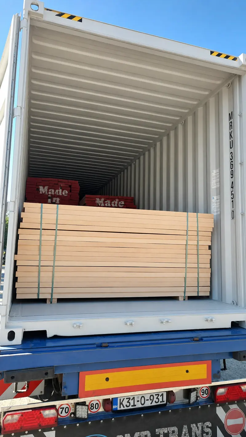 Strapped bundle of kiln-dried boards loaded into a shipping container